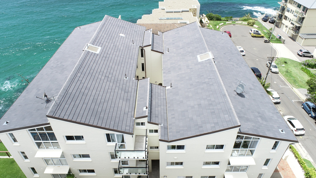 Monier roof tiles on coastal multi-storey residential apartment block.