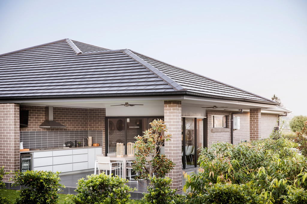 Monier roof tiles on residential house with garden.