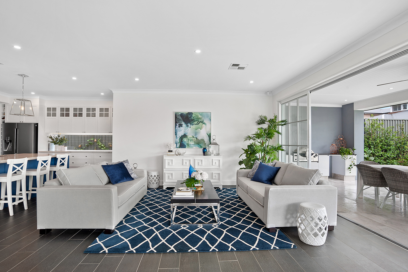 Open style Hamptons living area with two sofas facing each other. 